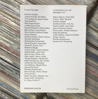 Stack of vinyl records with a list of contributors on a white card.