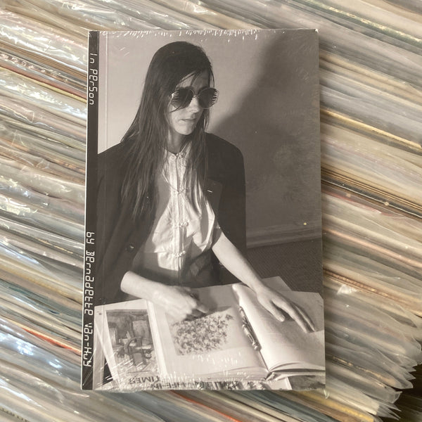 Vintage photo of a woman on a stack of records
