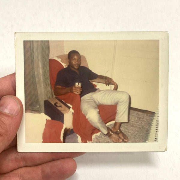 Photograph of Handsome African-American Man Seated Holding Glass