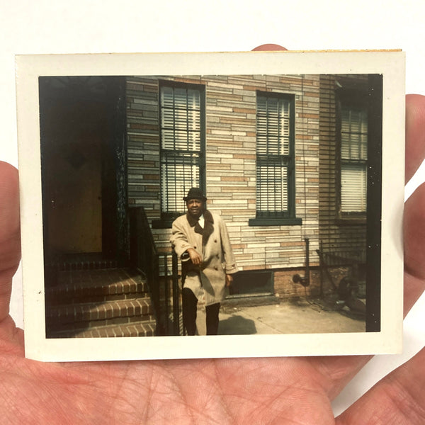 Photograph of African-American Man Posing Next to Stoop of Building